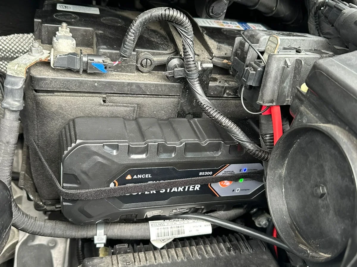 An ANCEL BS300 strapped beside the battery under the bonnet.